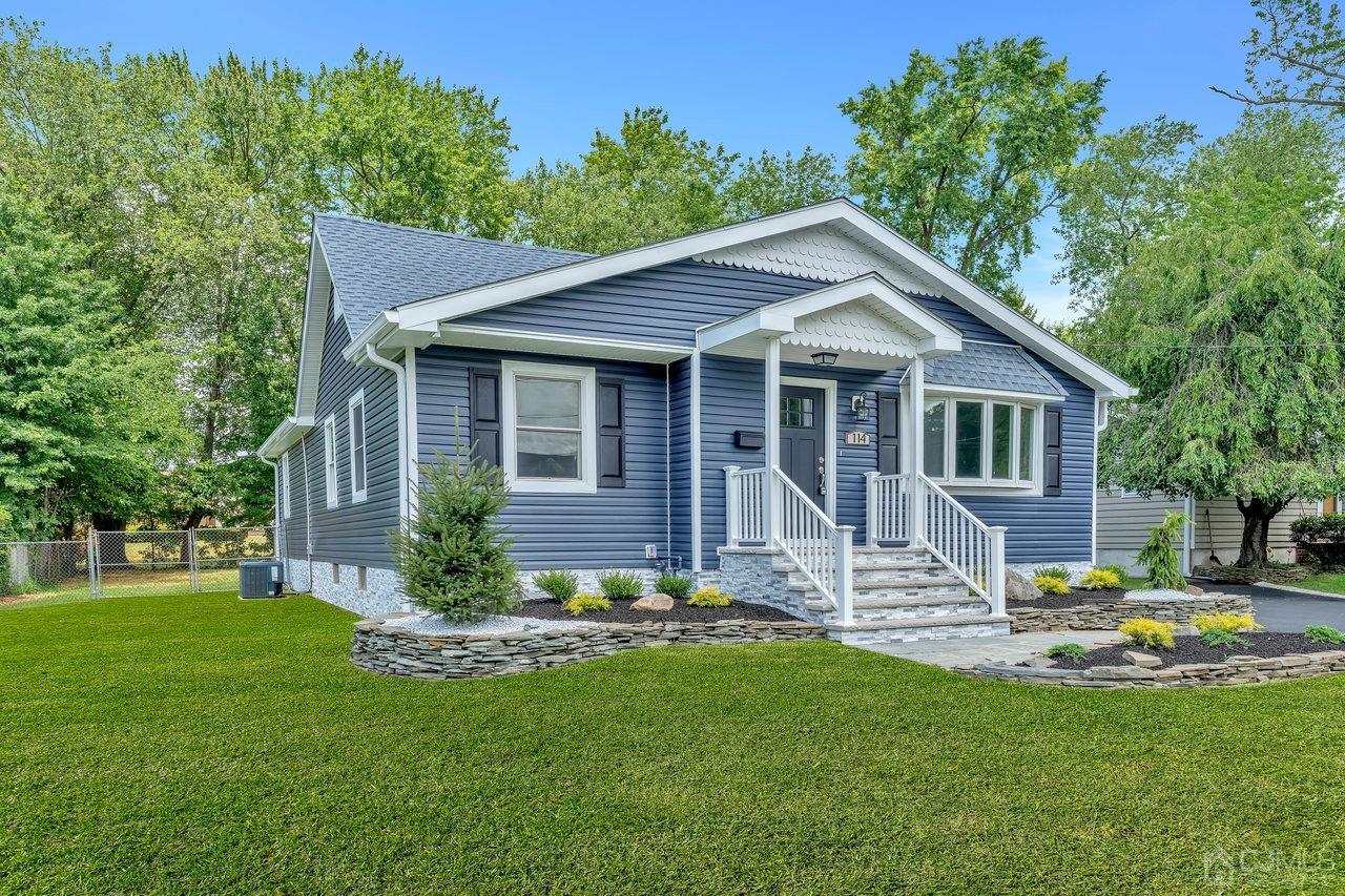 114 Morningside Road Colonia, NJ 07067 - Photo 3 of 27 a front view of a house with a yard table and chairs