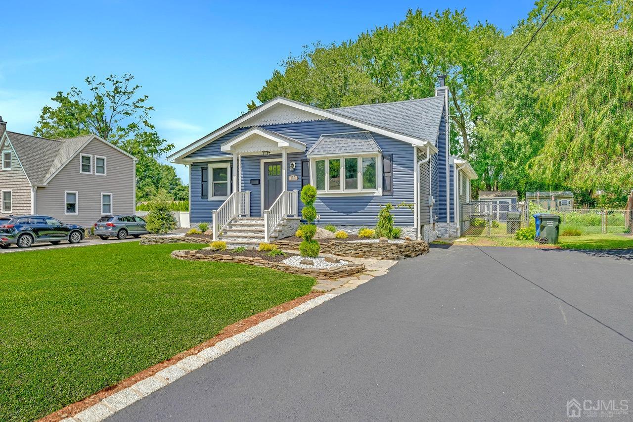 114 Morningside Road Colonia, NJ 07067 - Photo 4 of 27 a front view of a house with garden