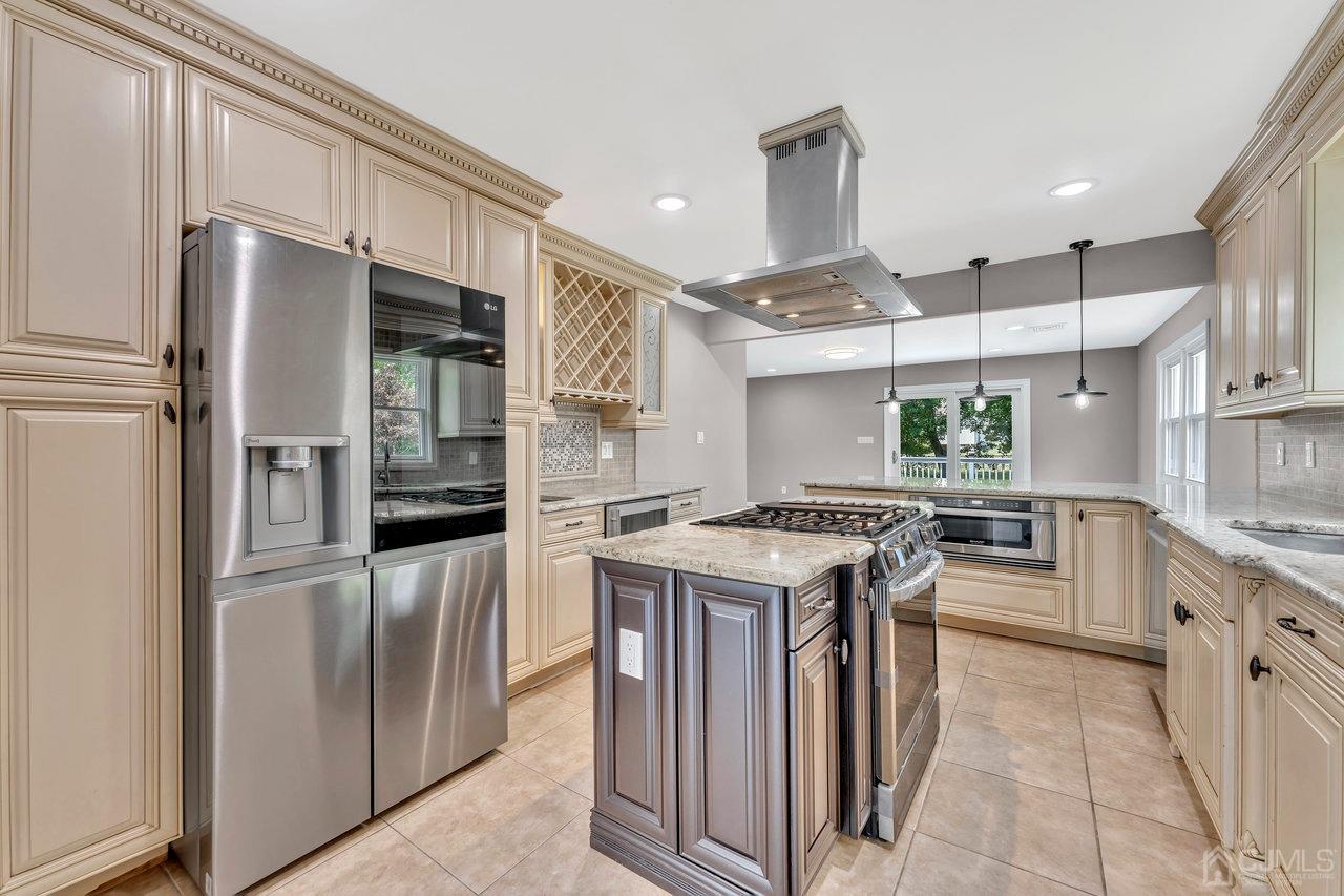 114 Morningside Road Colonia, NJ 07067 - Photo 9 of 27 a kitchen with stainless steel appliances granite countertop a stove oven and refrigerator