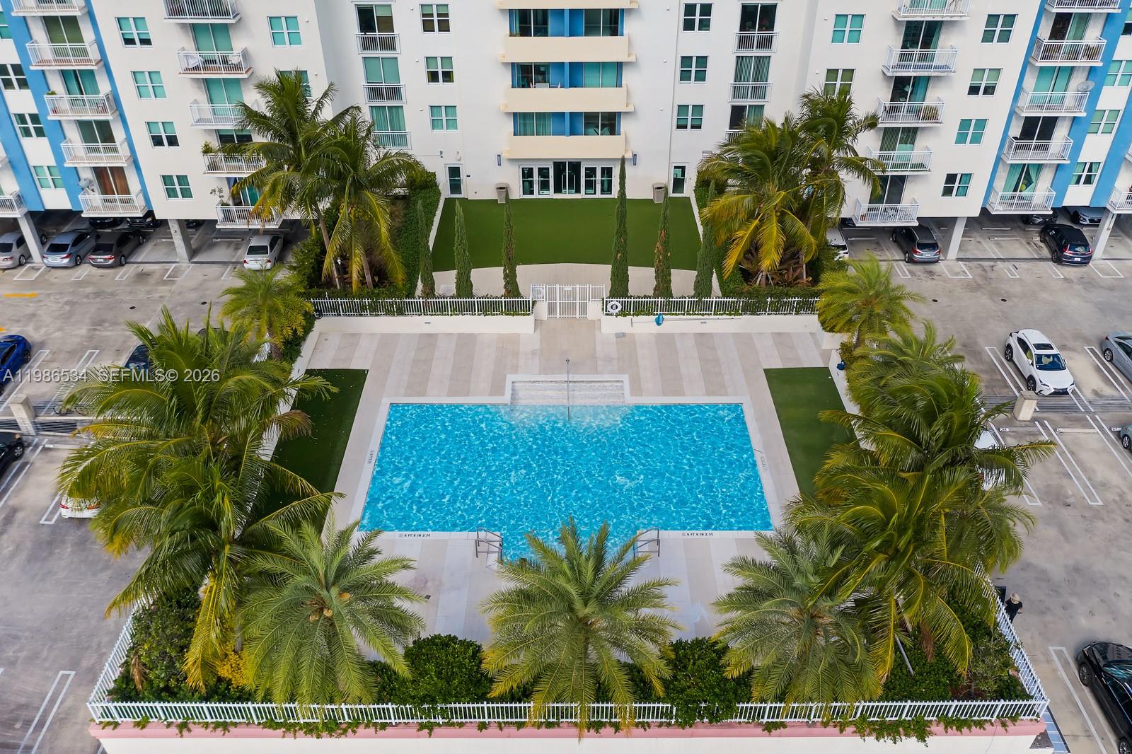 3000 Coral Way, Unit 416 Miami, FL 33145 - Photo 19 of 23 a view of a yard with plants and palm trees