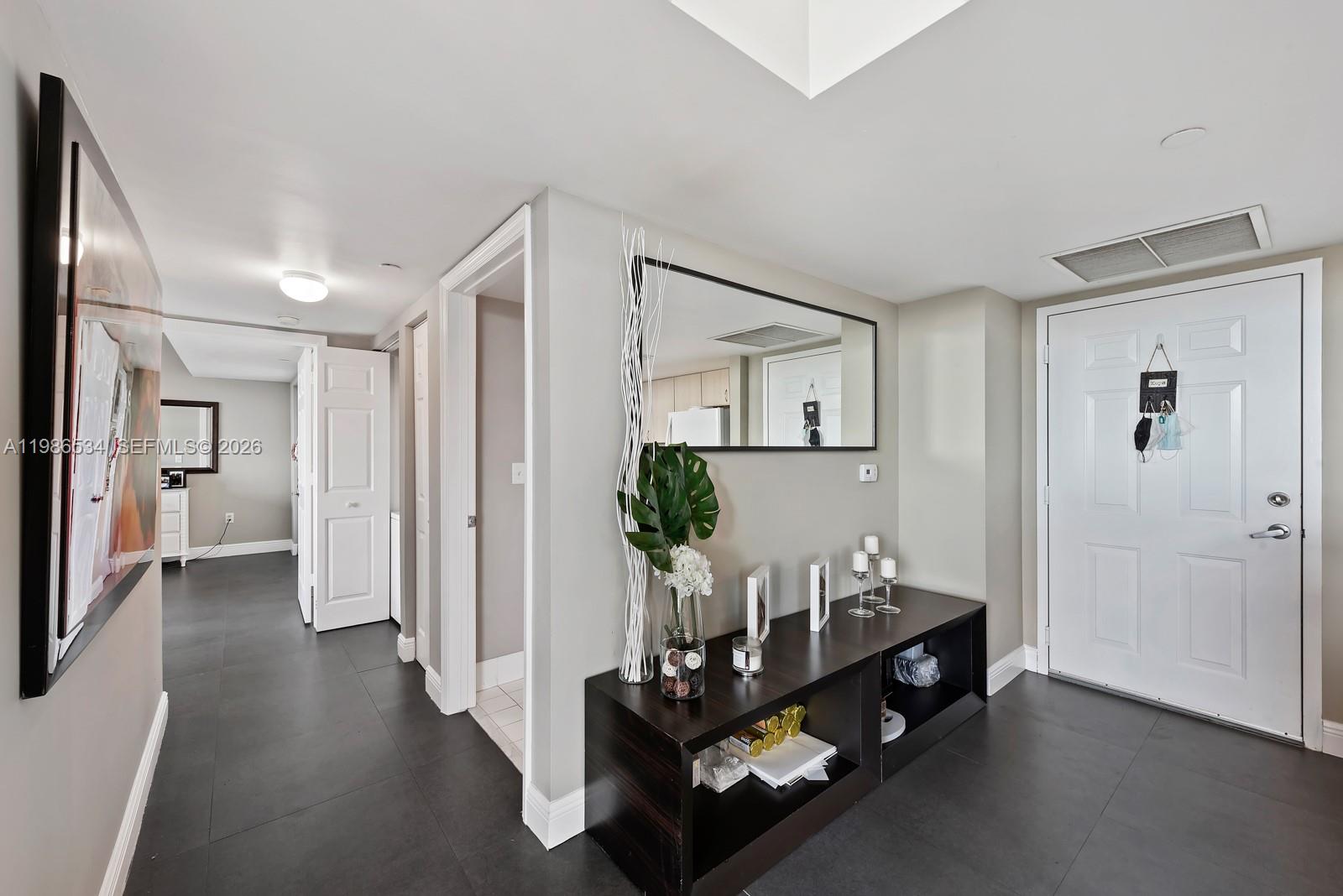3000 Coral Way, Unit 416 Miami, FL 33145 - Photo 6 of 23 a living room with furniture and wooden floor