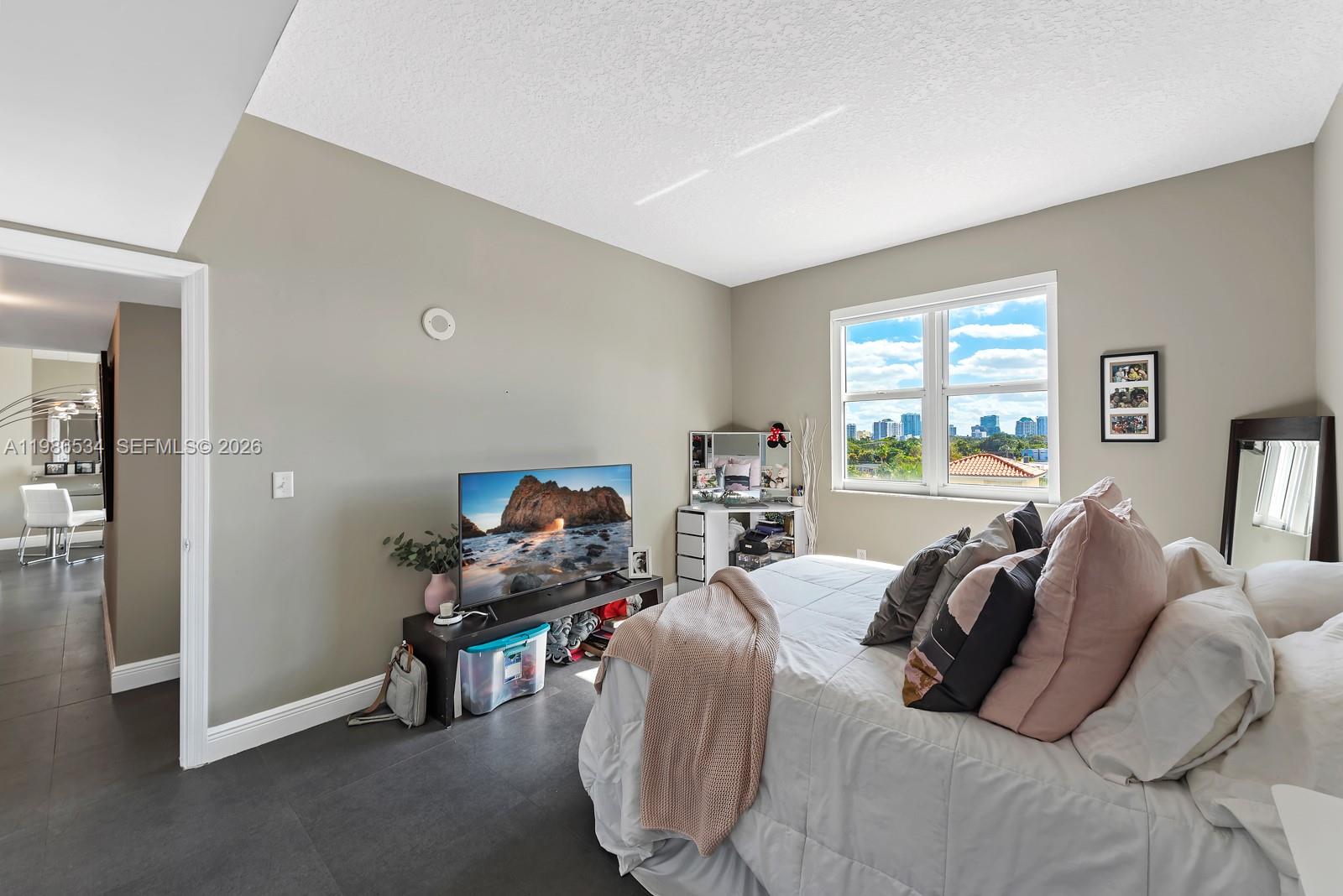 3000 Coral Way, Unit 416 Miami, FL 33145 - Photo 9 of 23 a bedroom with furniture and a window