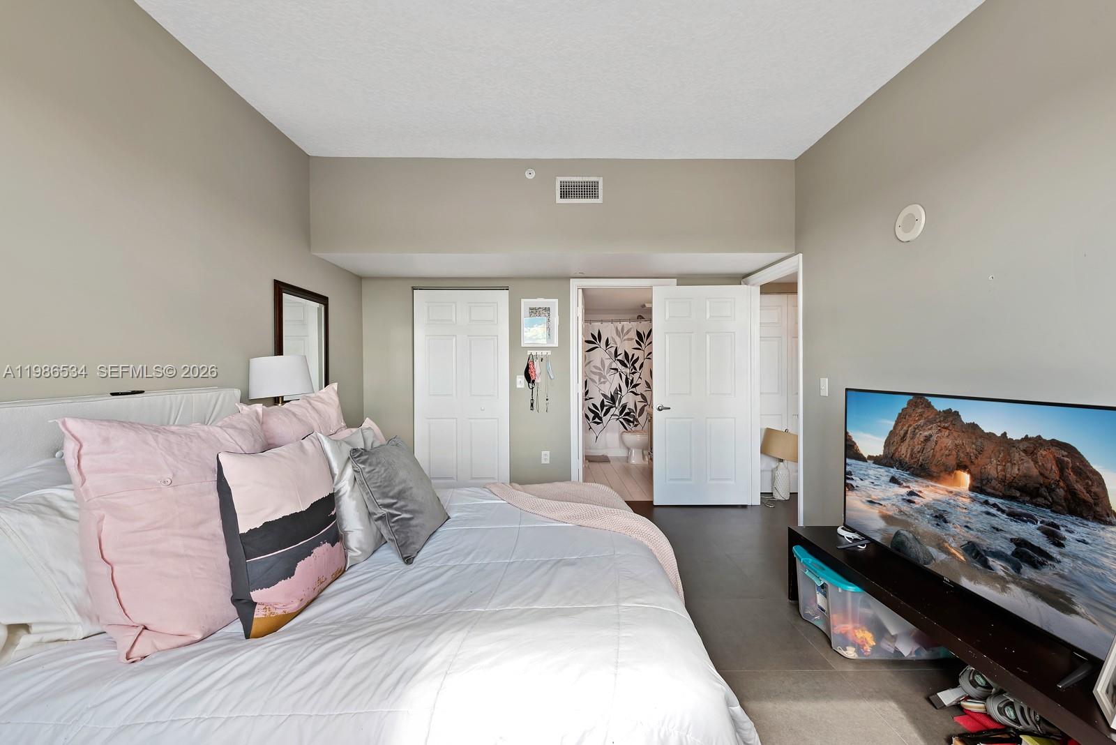 3000 Coral Way, Unit 416 Miami, FL 33145 - Photo 10 of 23 a bedroom with a bed and a couch