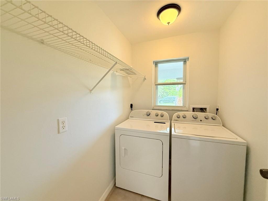 27595 Imperial River Road Bonita Springs, FL 34134 - Photo 13 of 28 a utility room with dryer and washer