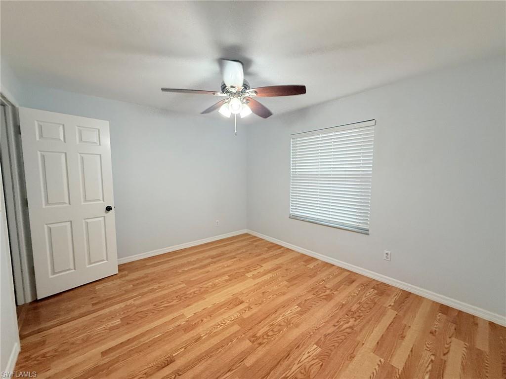 27595 Imperial River Road Bonita Springs, FL 34134 - Photo 18 of 28 a view of an empty room with a window