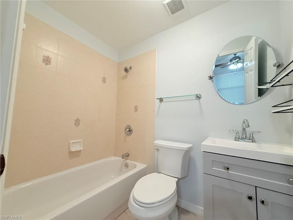 27595 Imperial River Road Bonita Springs, FL 34134 - Photo 19 of 28 a bathroom with a sink a toilet and bathtub