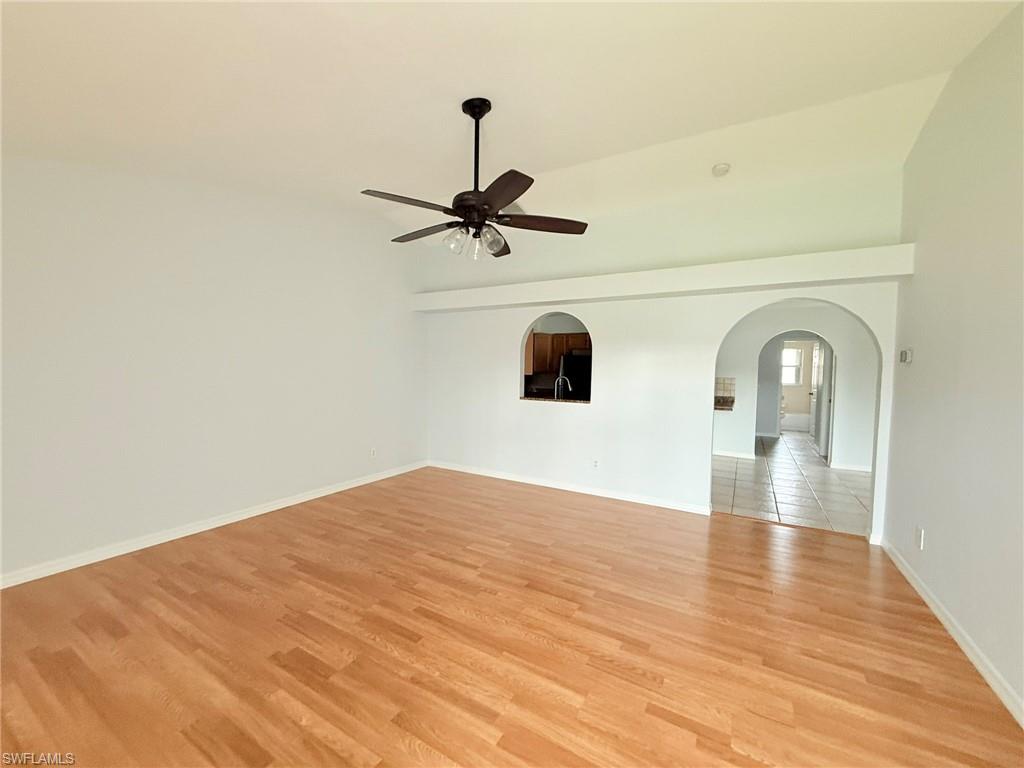 27595 Imperial River Road Bonita Springs, FL 34134 - Photo 4 of 28 a view of empty room with wooden floor