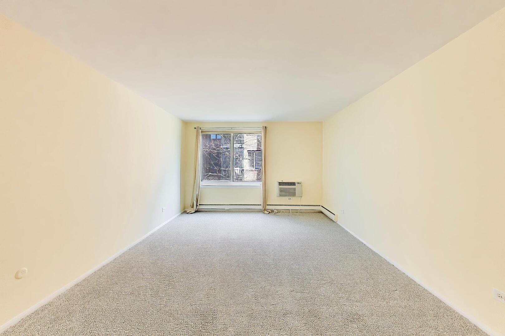 2324 Central Street, Unit 2B Evanston, IL 60201 - Photo 14 of 28 an empty room with windows