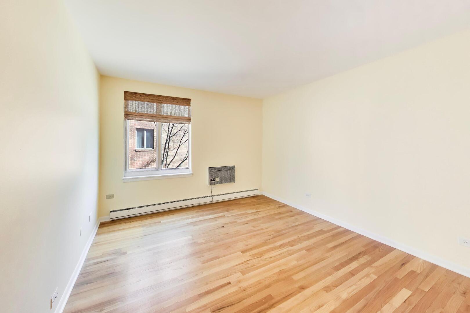 2324 Central Street, Unit 2B Evanston, IL 60201 - Photo 21 of 28 a view of an empty room with a window