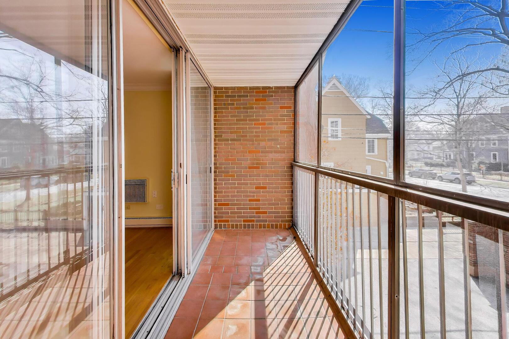 2324 Central Street, Unit 2B Evanston, IL 60201 - Photo 25 of 28 a view of a balcony with wooden floor