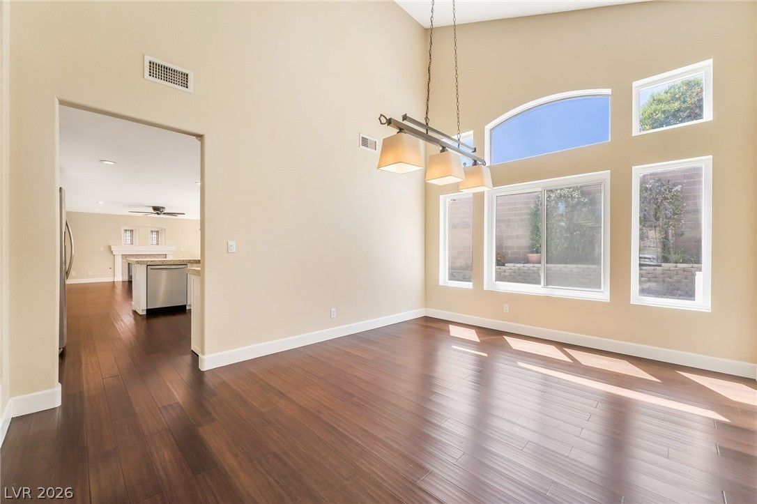 271 Pointe Ranier Avenue Henderson, NV 89012 - Photo 5 of 26 This airy space features rich hardwood floors and abundant natural light through expansive windows.