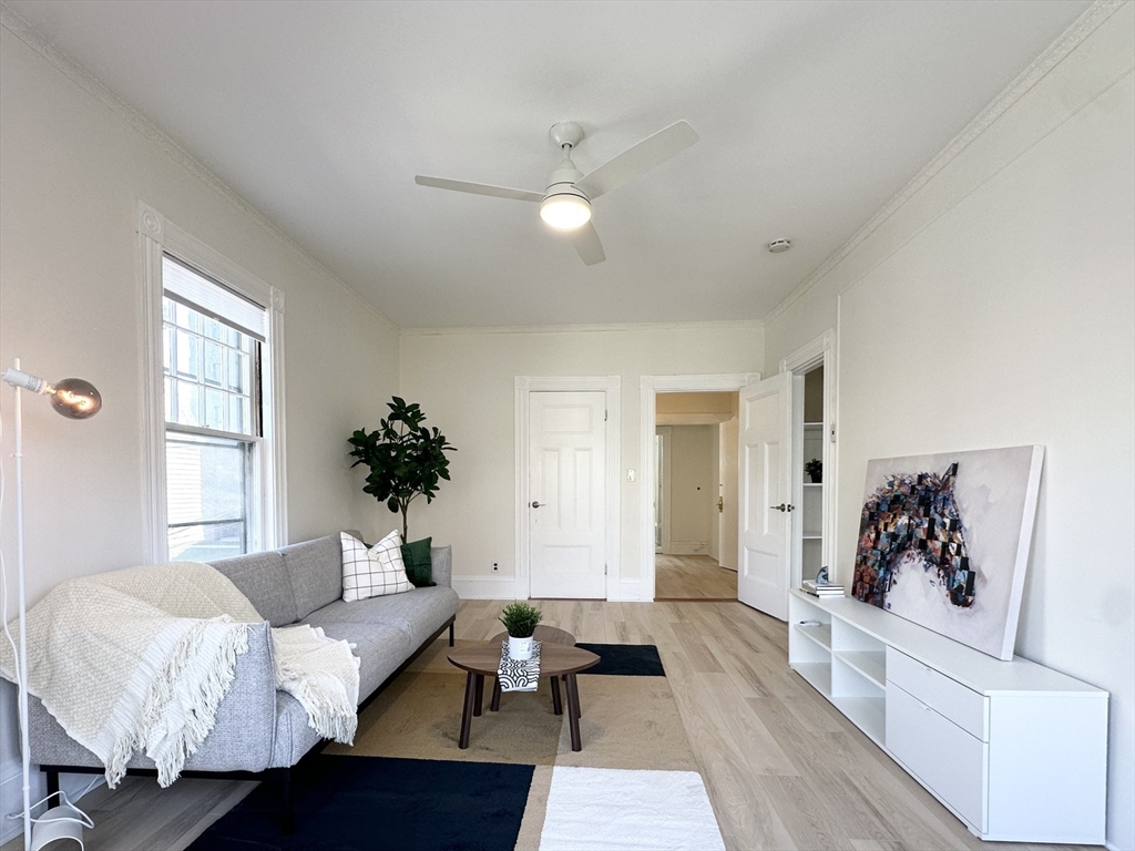 a living room with furniture and window