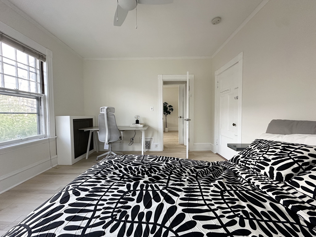 71 A Gardner Street, Unit 2 Boston, MA 02134 - Photo 11 of 13 a black and white photo of a bedroom