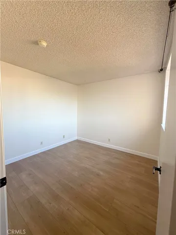 a view of an empty room and a window