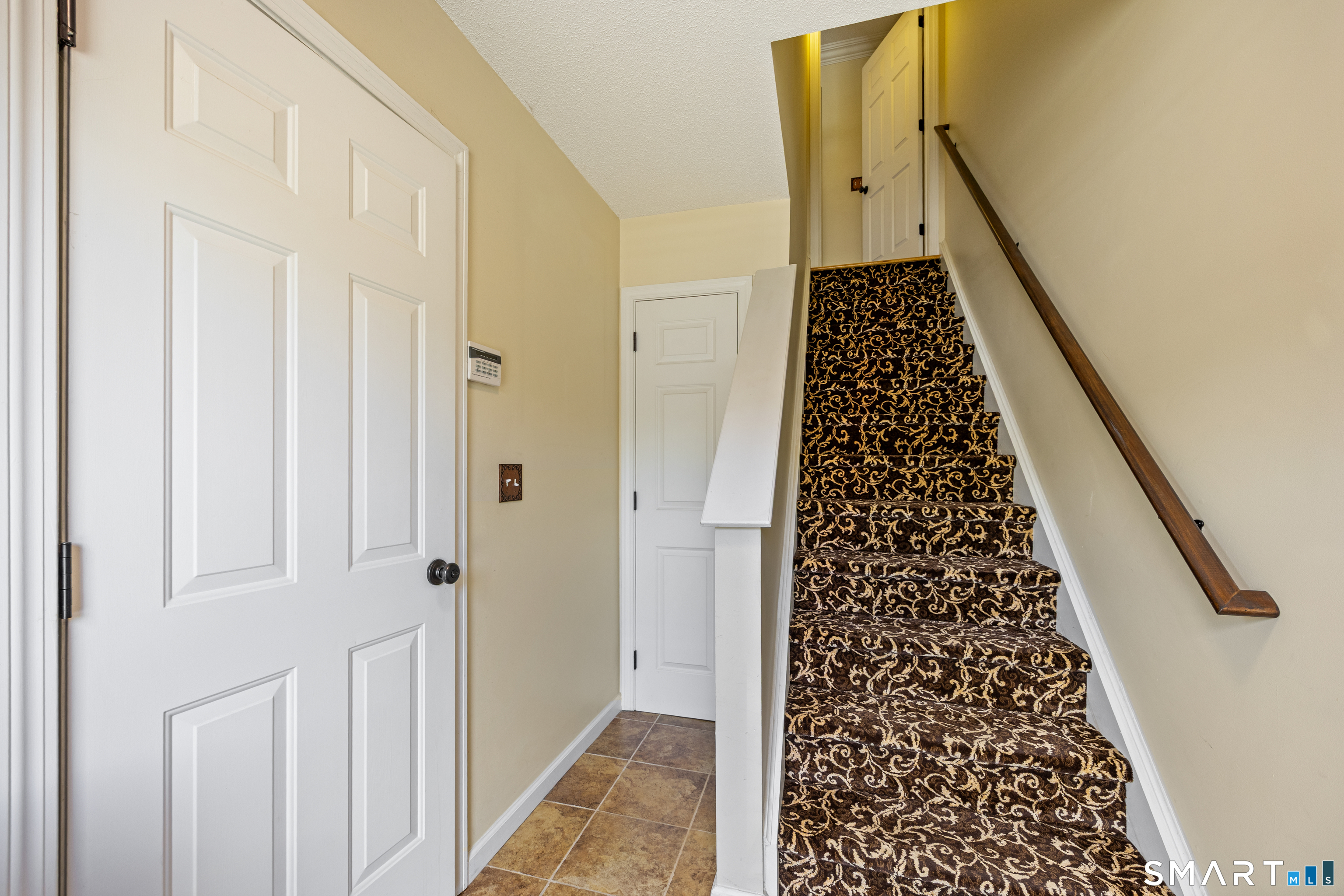 119 Taft Pointe, Unit 3 Waterbury, CT 06708 - Photo 27 of 29 Entrance, door to garage and closet. Stairs to main level.