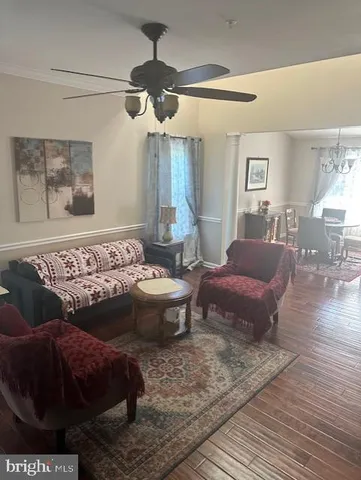a living room with furniture and a rug