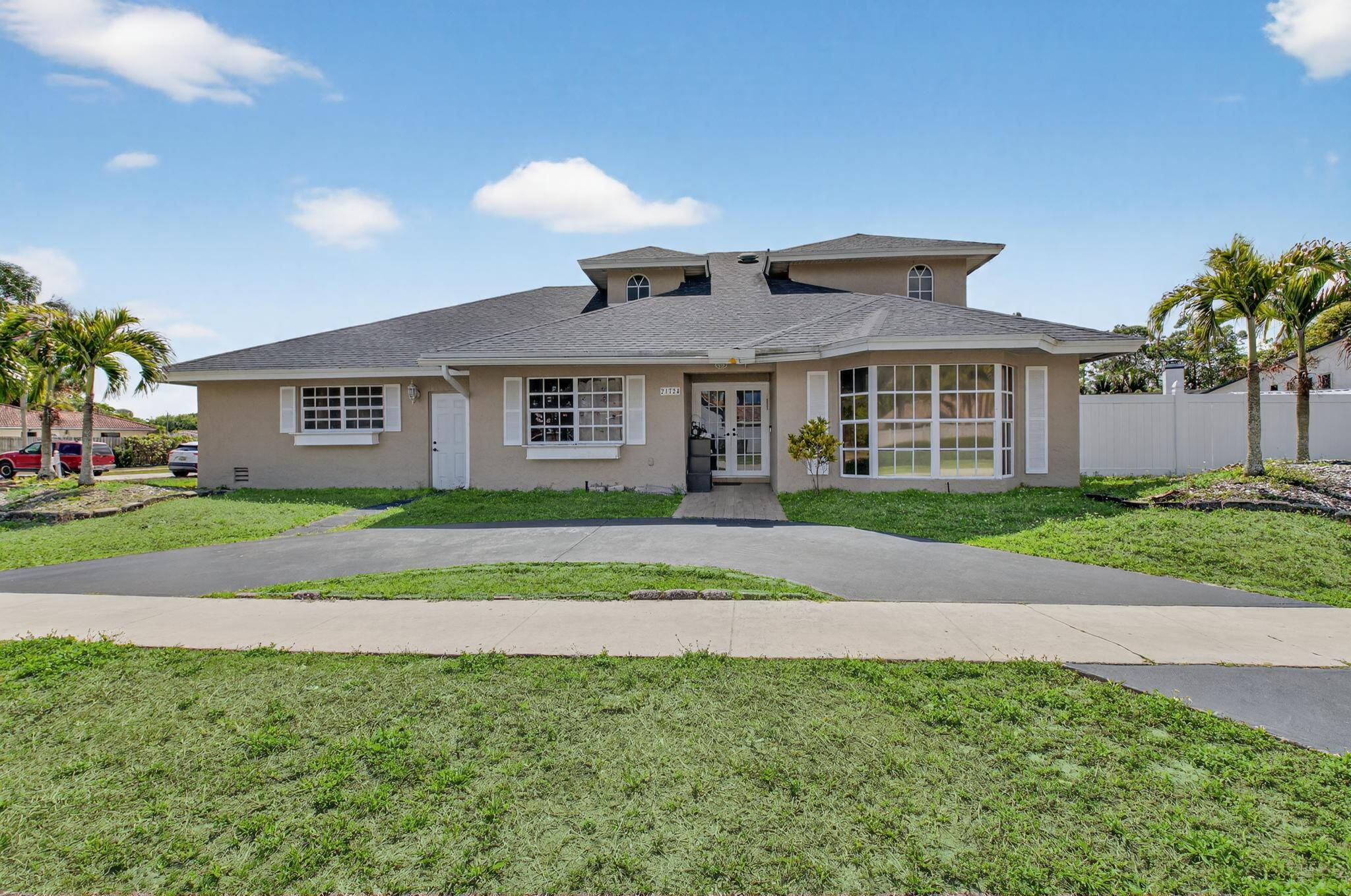 a view of front a house with a yard