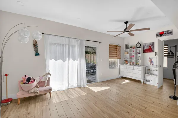 a view of an empty room and wooden floor