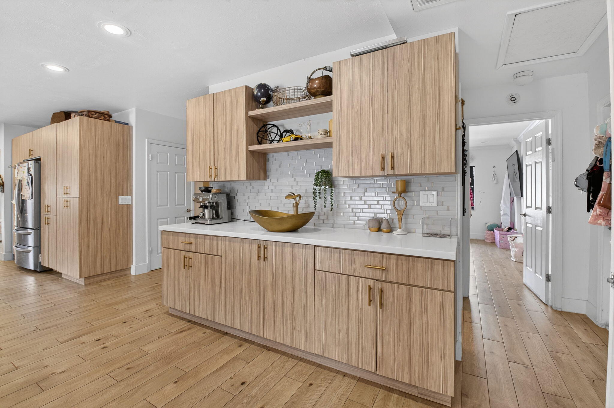 21724 Little Bear Way Boca Raton, FL 33428 - Photo 32 of 47 a kitchen with stainless steel appliances a refrigerator and wooden floor