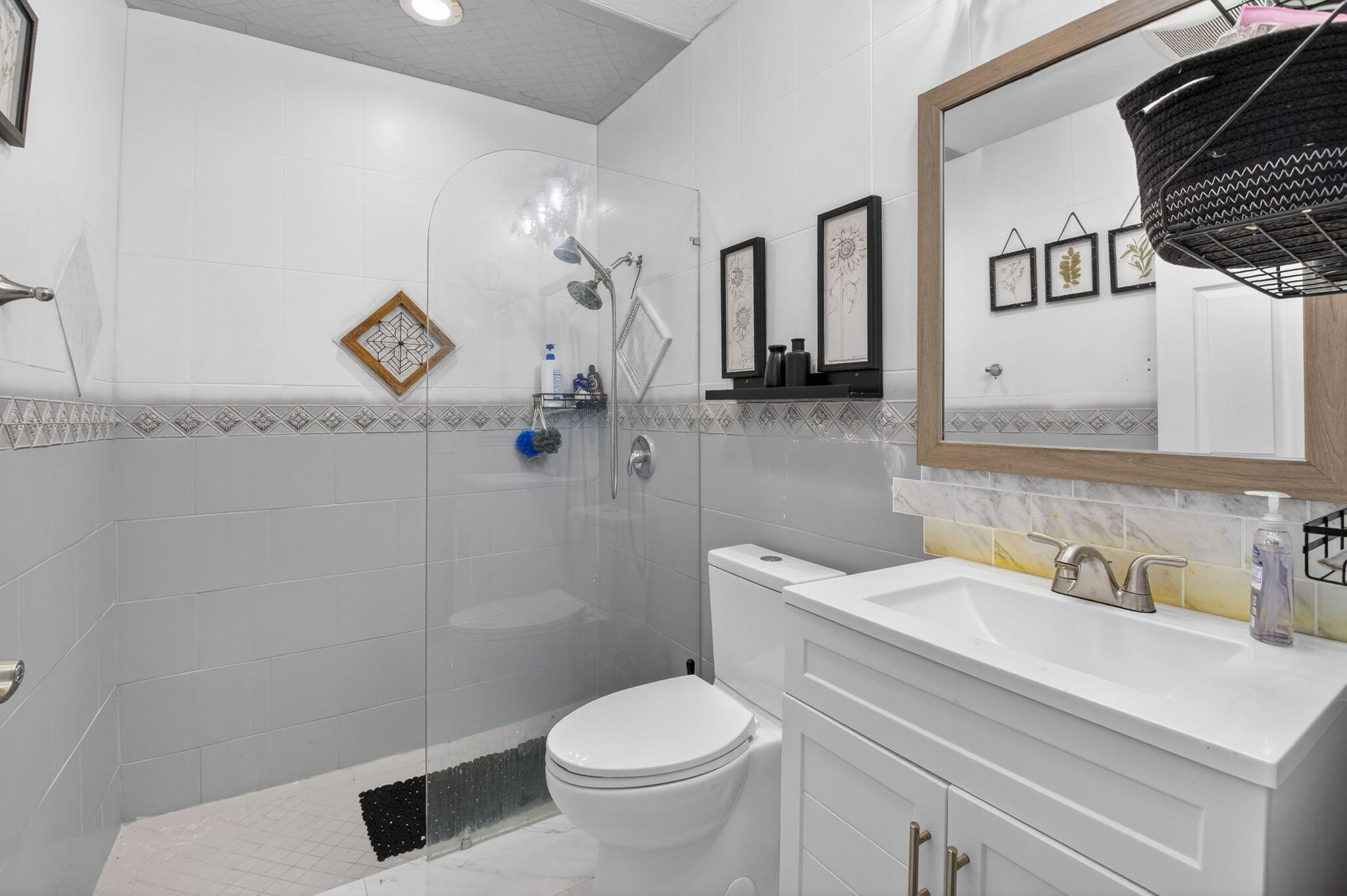 21724 Little Bear Way Boca Raton, FL 33428 - Photo 35 of 47 a bathroom with a toilet sink and mirror