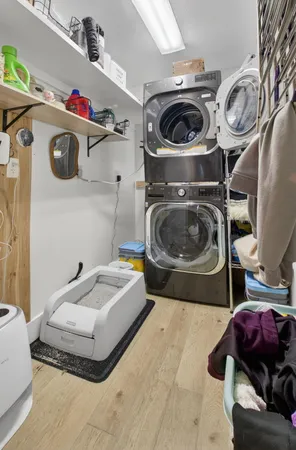 a utility room with sink dryer and washer