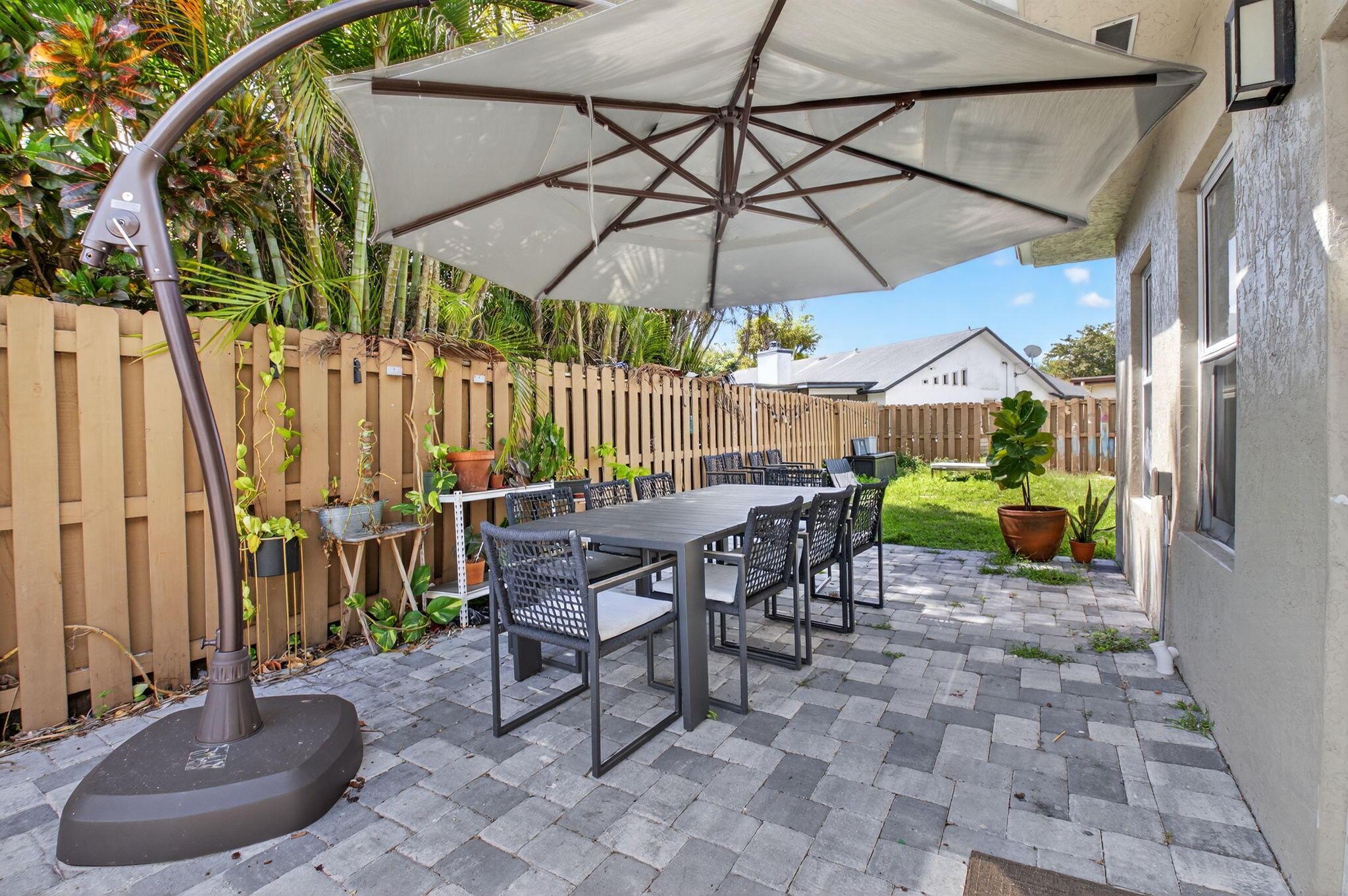 21724 Little Bear Way Boca Raton, FL 33428 - Photo 37 of 47 a view of a chairs and table in backyard