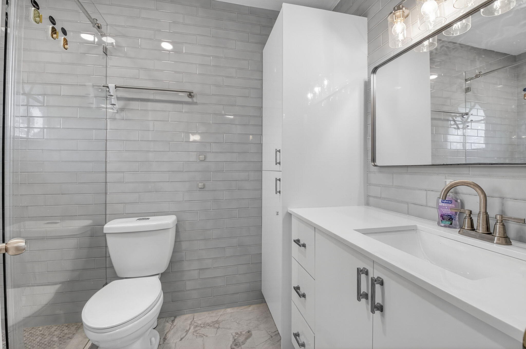 21724 Little Bear Way Boca Raton, FL 33428 - Photo 45 of 47 a bathroom with a toilet sink and mirror