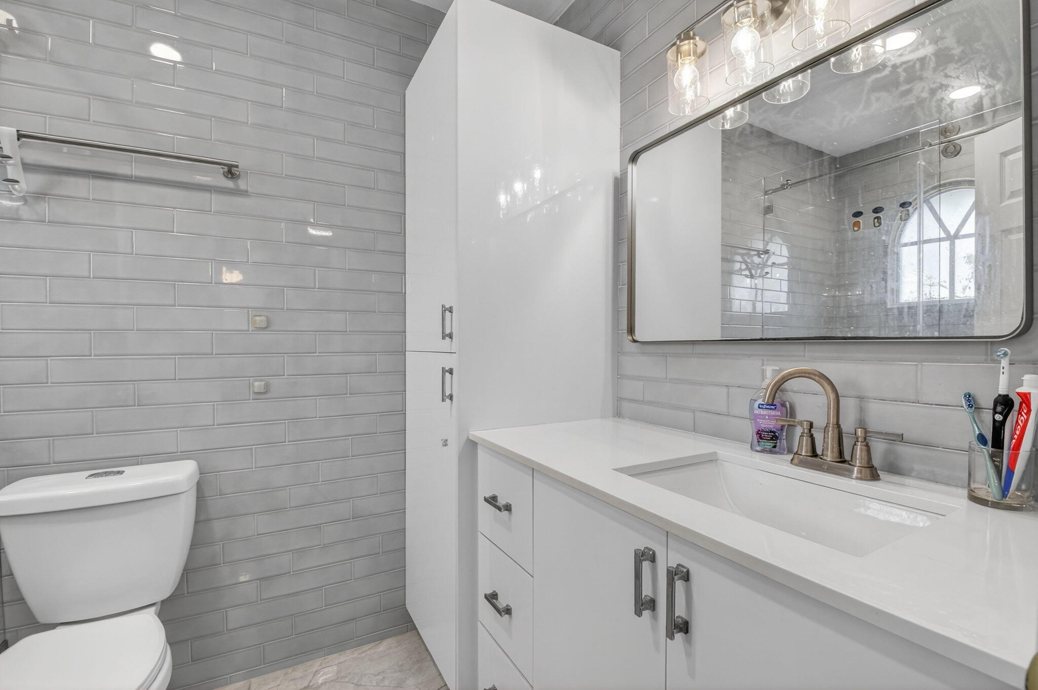 21724 Little Bear Way Boca Raton, FL 33428 - Photo 46 of 47 a bathroom with a toilet sink and mirror