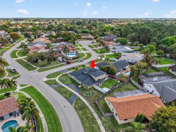 an aerial view of a house with a garden