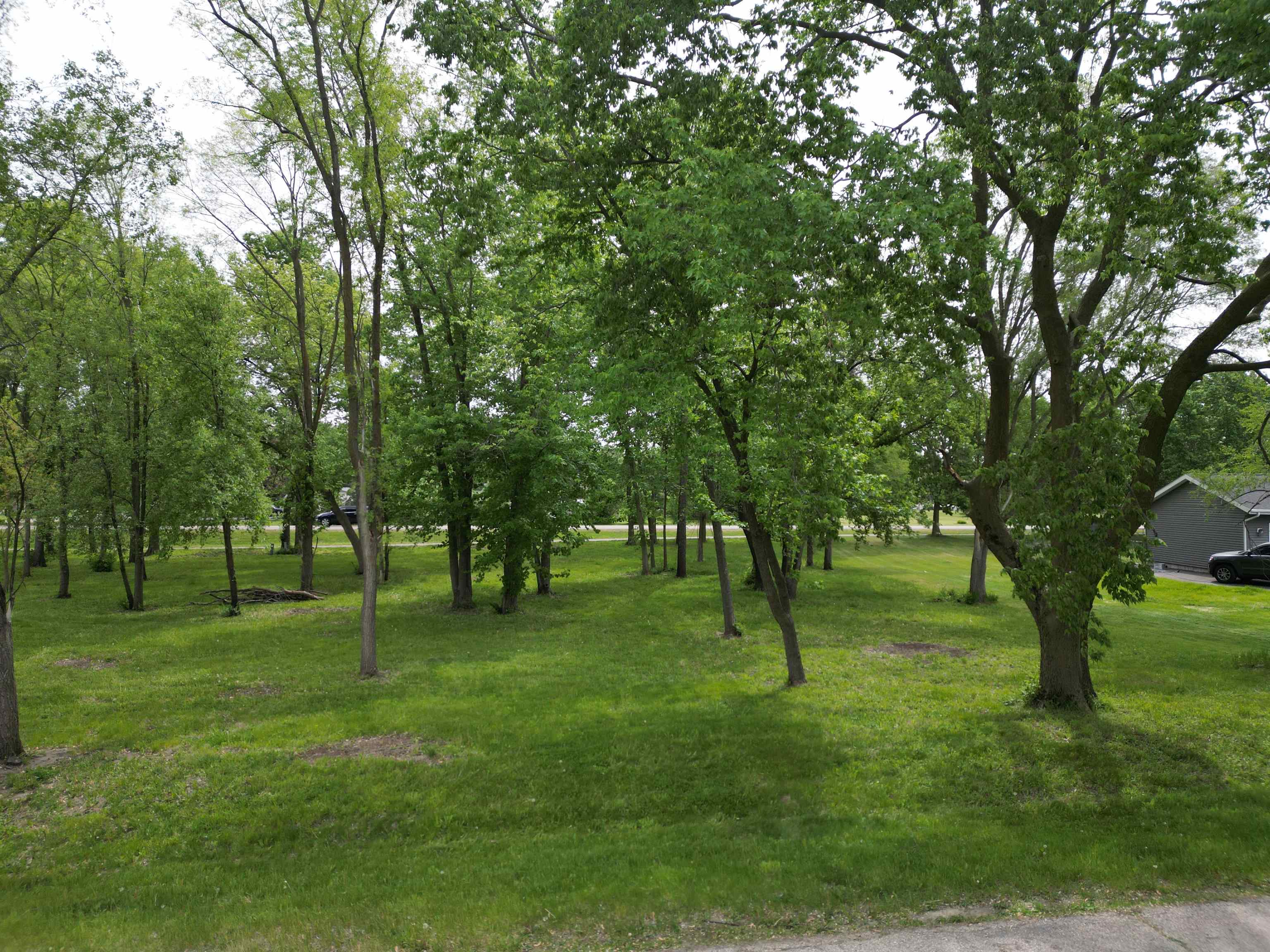 03 Nautical Court Rockton, IL 61072 - Photo 2 of 10 a green field with lots of trees