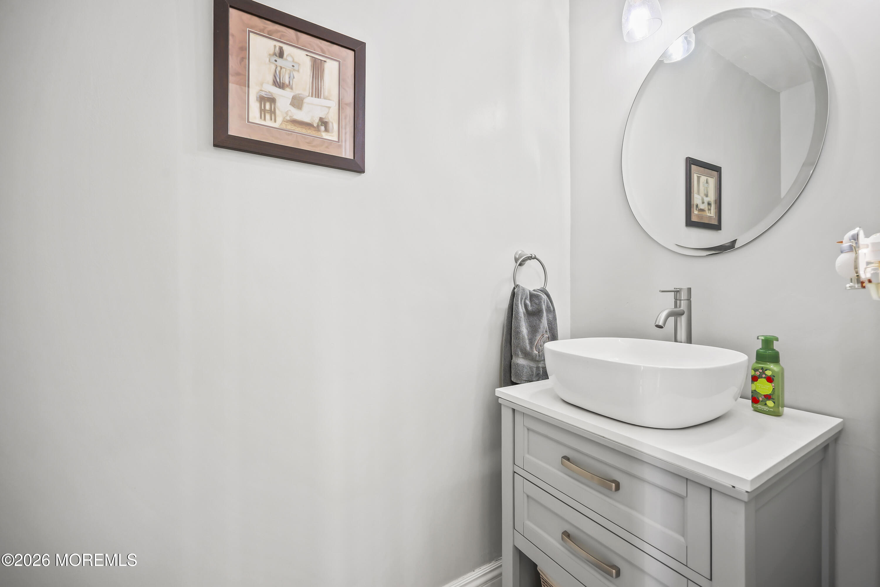 17 Sun Hollow Road Howell, NJ 07731 - Photo 19 of 43 a bathroom with a sink and a mirror