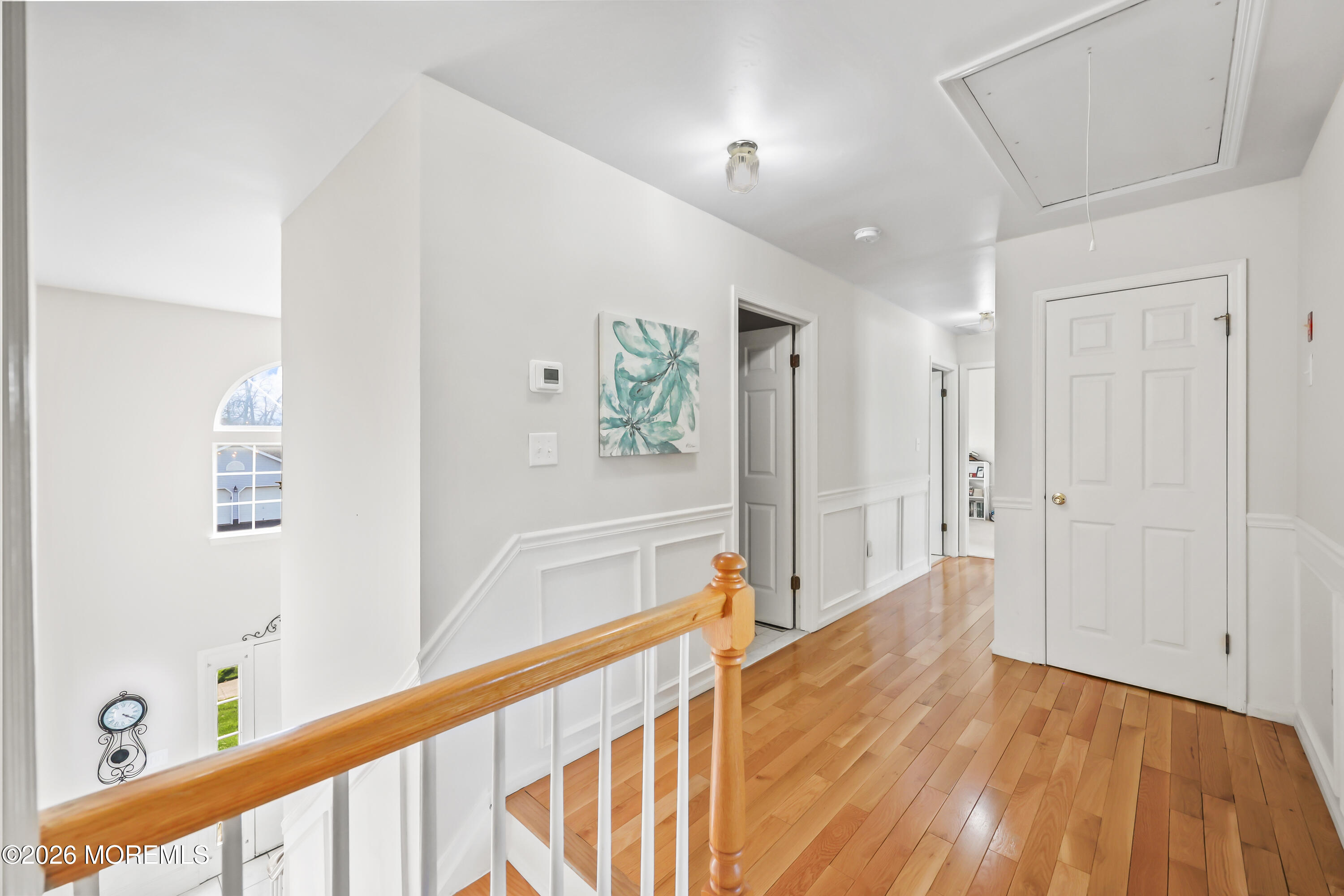17 Sun Hollow Road Howell, NJ 07731 - Photo 20 of 43 a view of a big room with wooden floor and windows