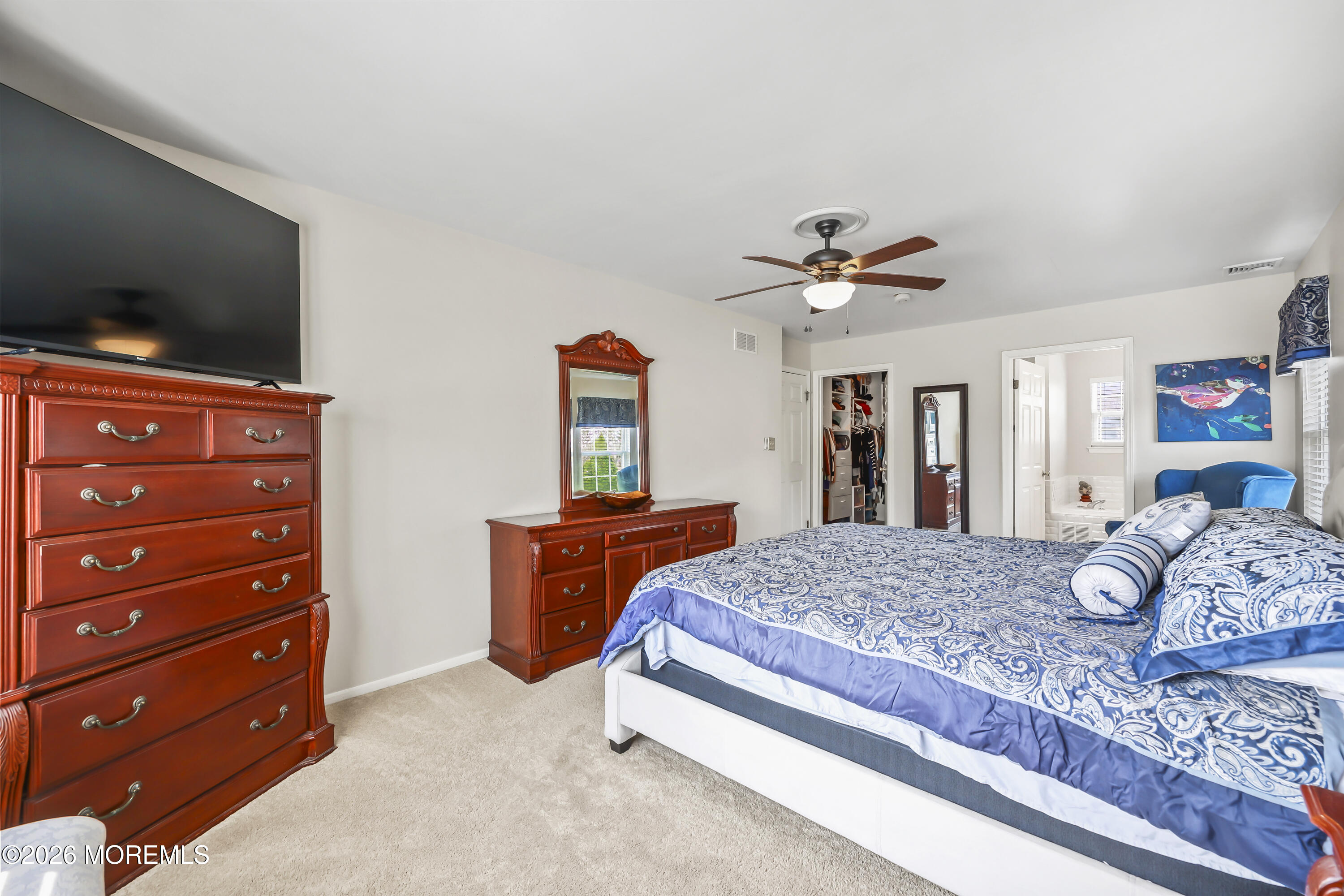 17 Sun Hollow Road Howell, NJ 07731 - Photo 22 of 43 a bedroom with a bed and a flat screen tv