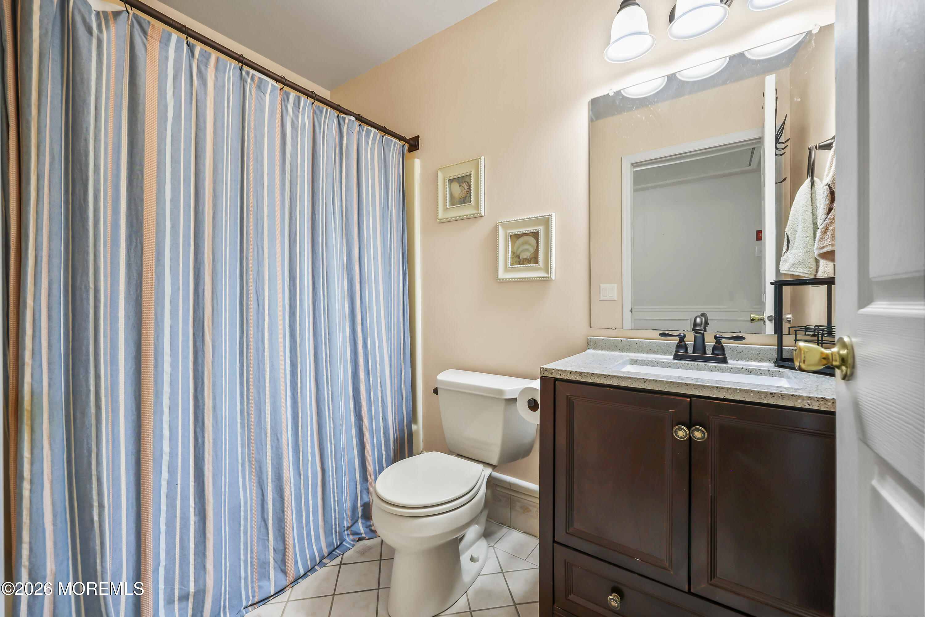 17 Sun Hollow Road Howell, NJ 07731 - Photo 29 of 43 a bathroom with a toilet a sink and a mirror