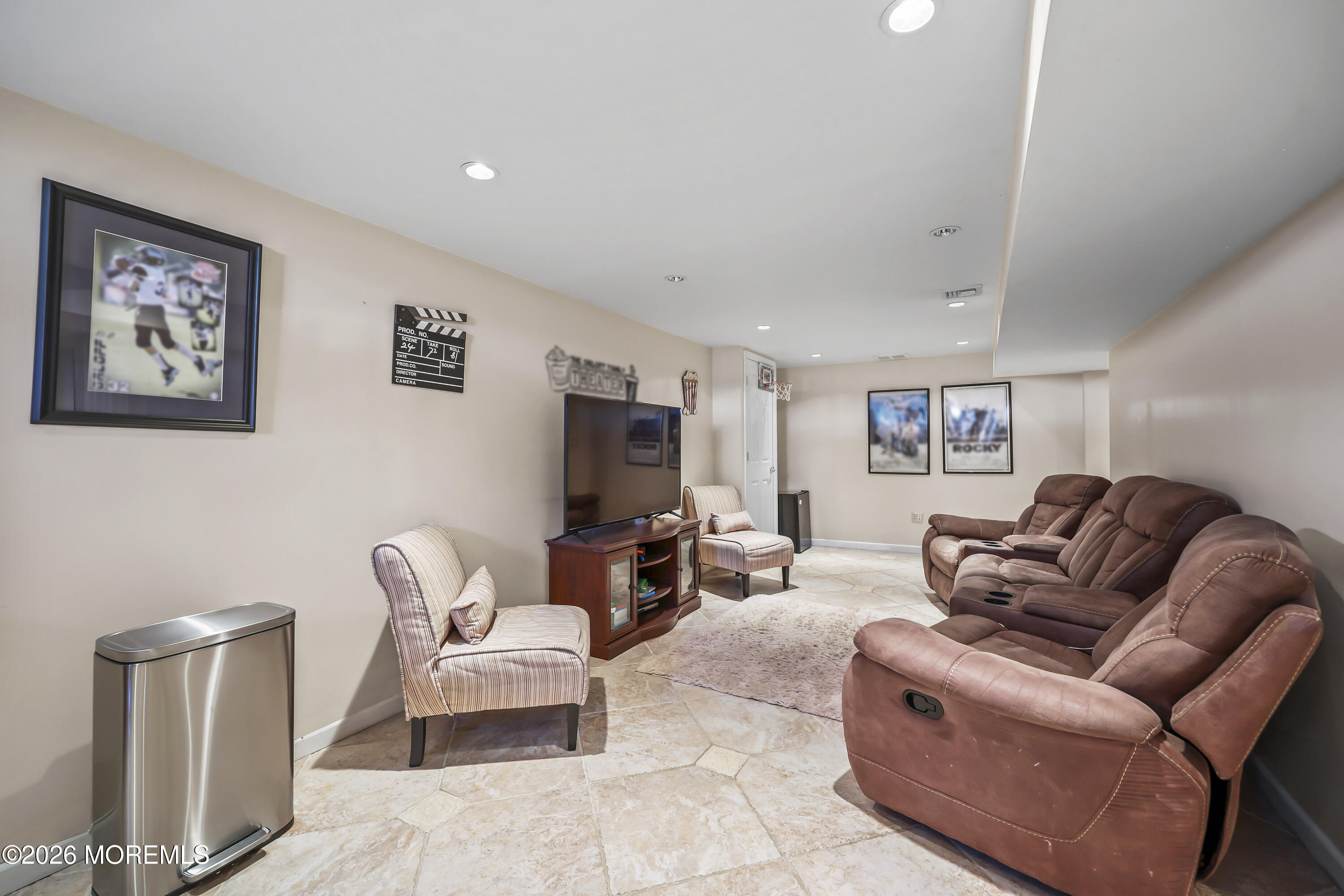 17 Sun Hollow Road Howell, NJ 07731 - Photo 31 of 43 a living room with furniture a couch and a flat screen tv