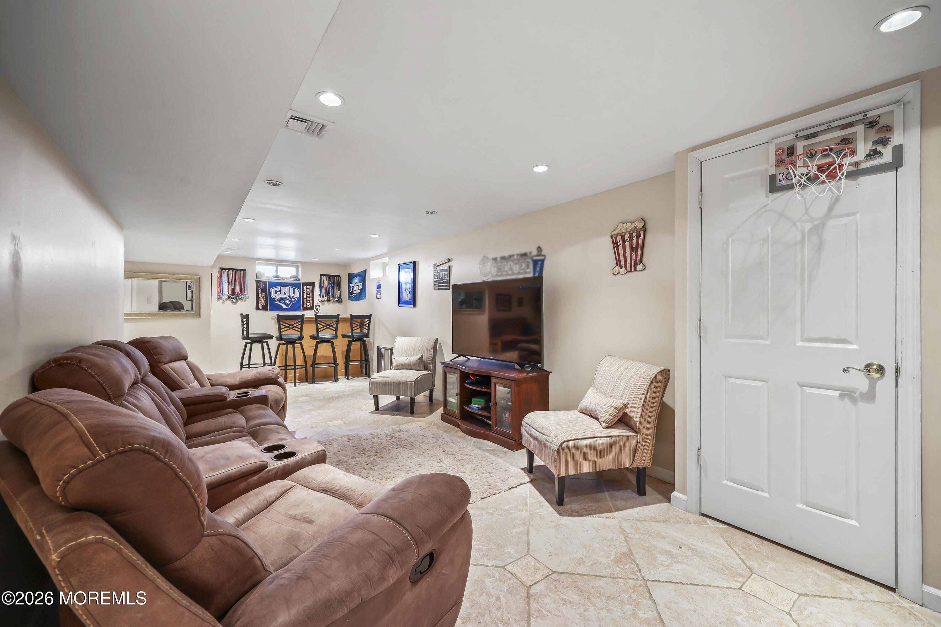 17 Sun Hollow Road Howell, NJ 07731 - Photo 32 of 43 a living room with furniture and a flat screen tv