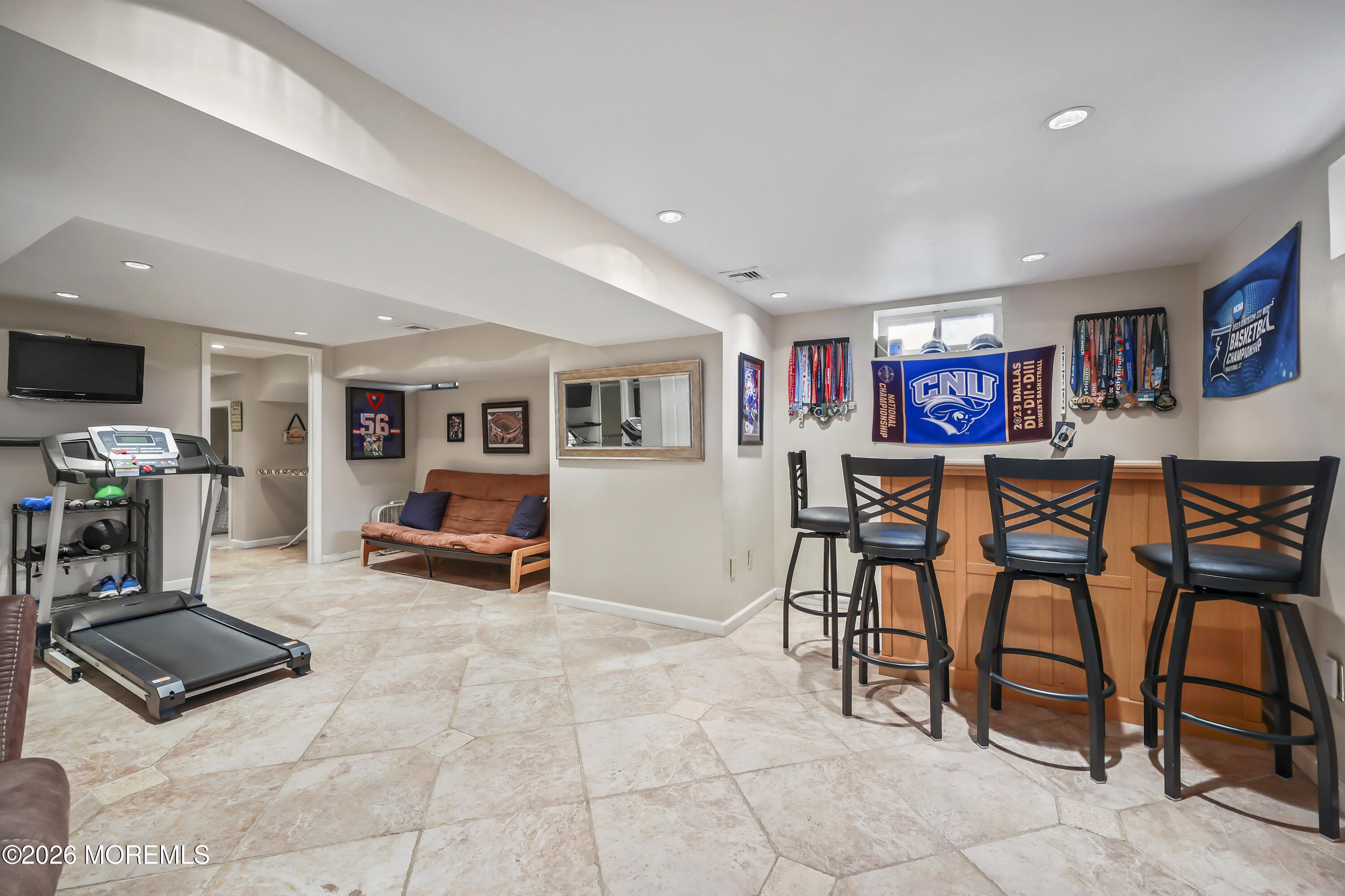 17 Sun Hollow Road Howell, NJ 07731 - Photo 33 of 43 a living room with furniture and a flat screen tv