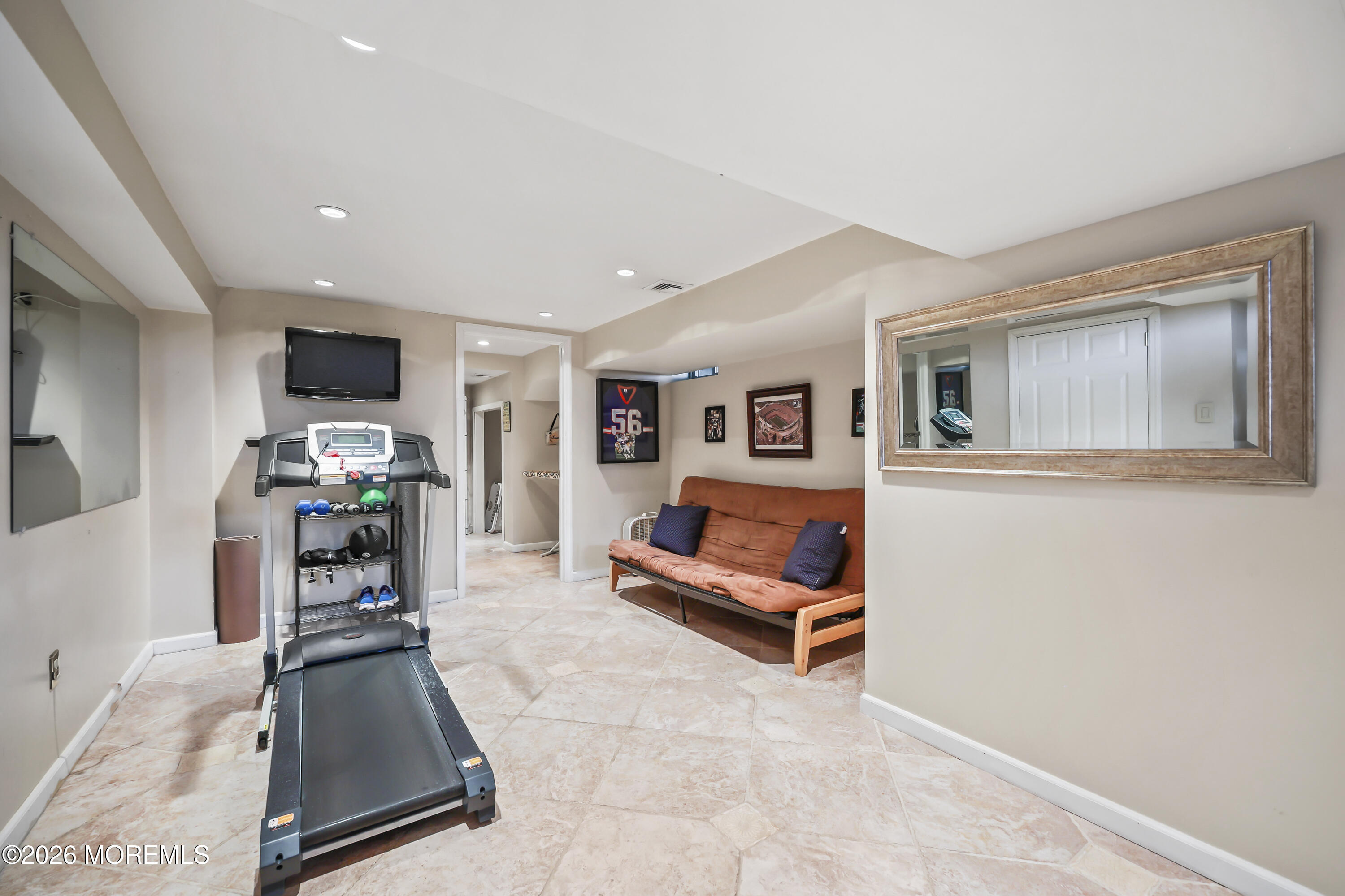 17 Sun Hollow Road Howell, NJ 07731 - Photo 34 of 43 a living room with furniture and a flat screen tv
