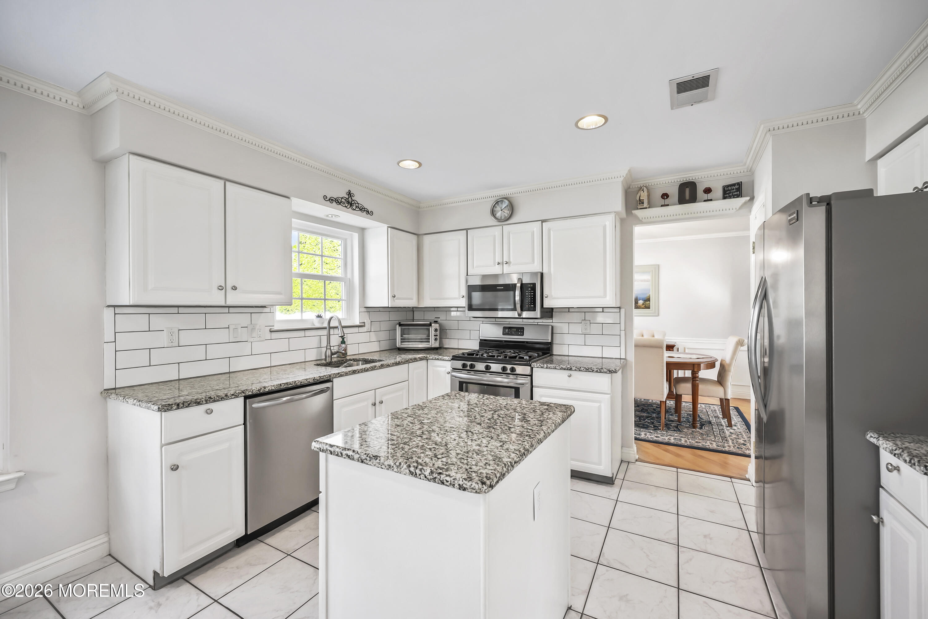 17 Sun Hollow Road Howell, NJ 07731 - Photo 9 of 43 a kitchen with a refrigerator a sink a stove a microwave and island