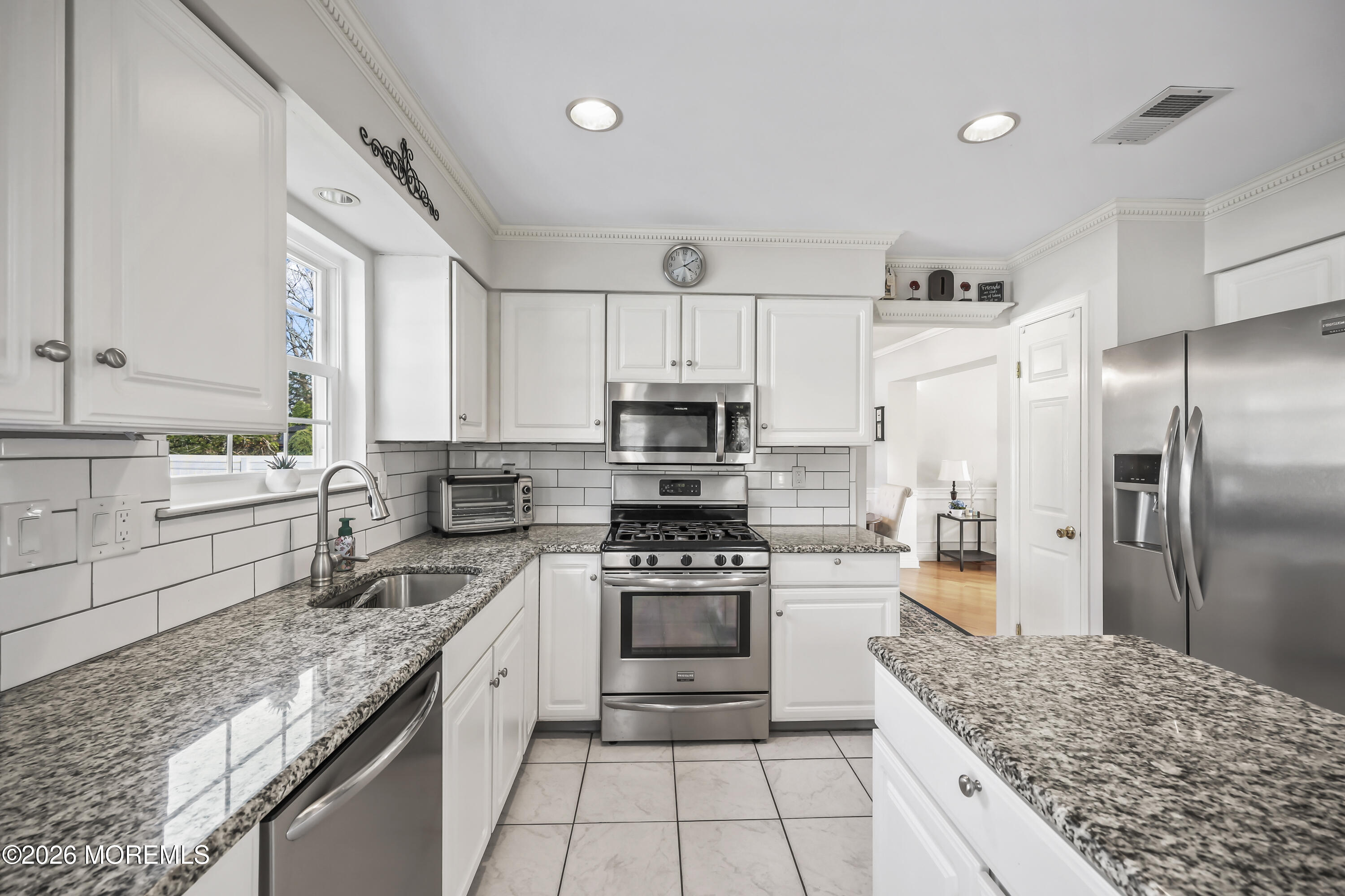 17 Sun Hollow Road Howell, NJ 07731 - Photo 10 of 43 a kitchen with a stove a sink and a refrigerator