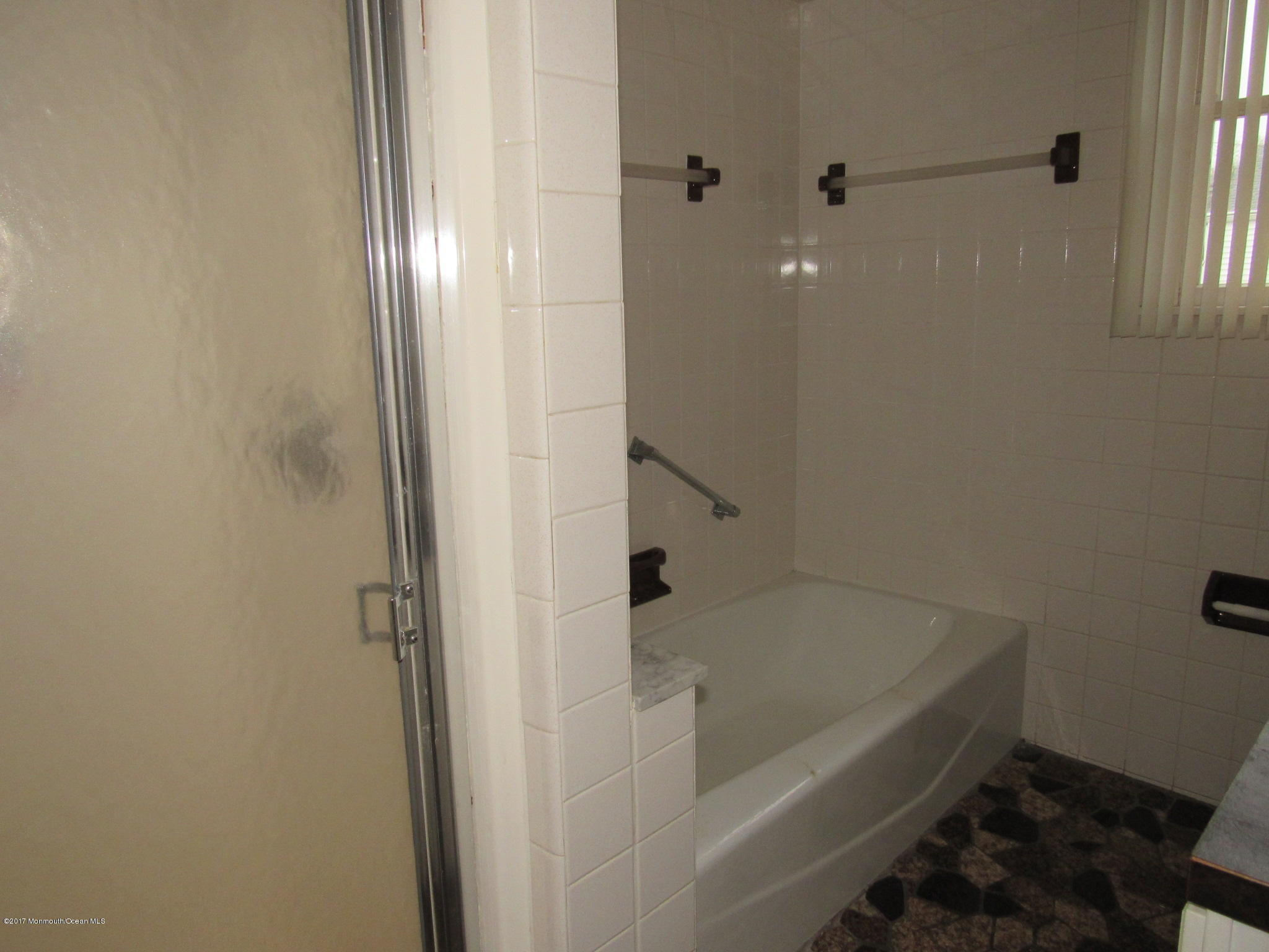 1136 Minnesink Road Manasquan, NJ 08736 - Photo 6 of 9 a bathroom with a bathtub
