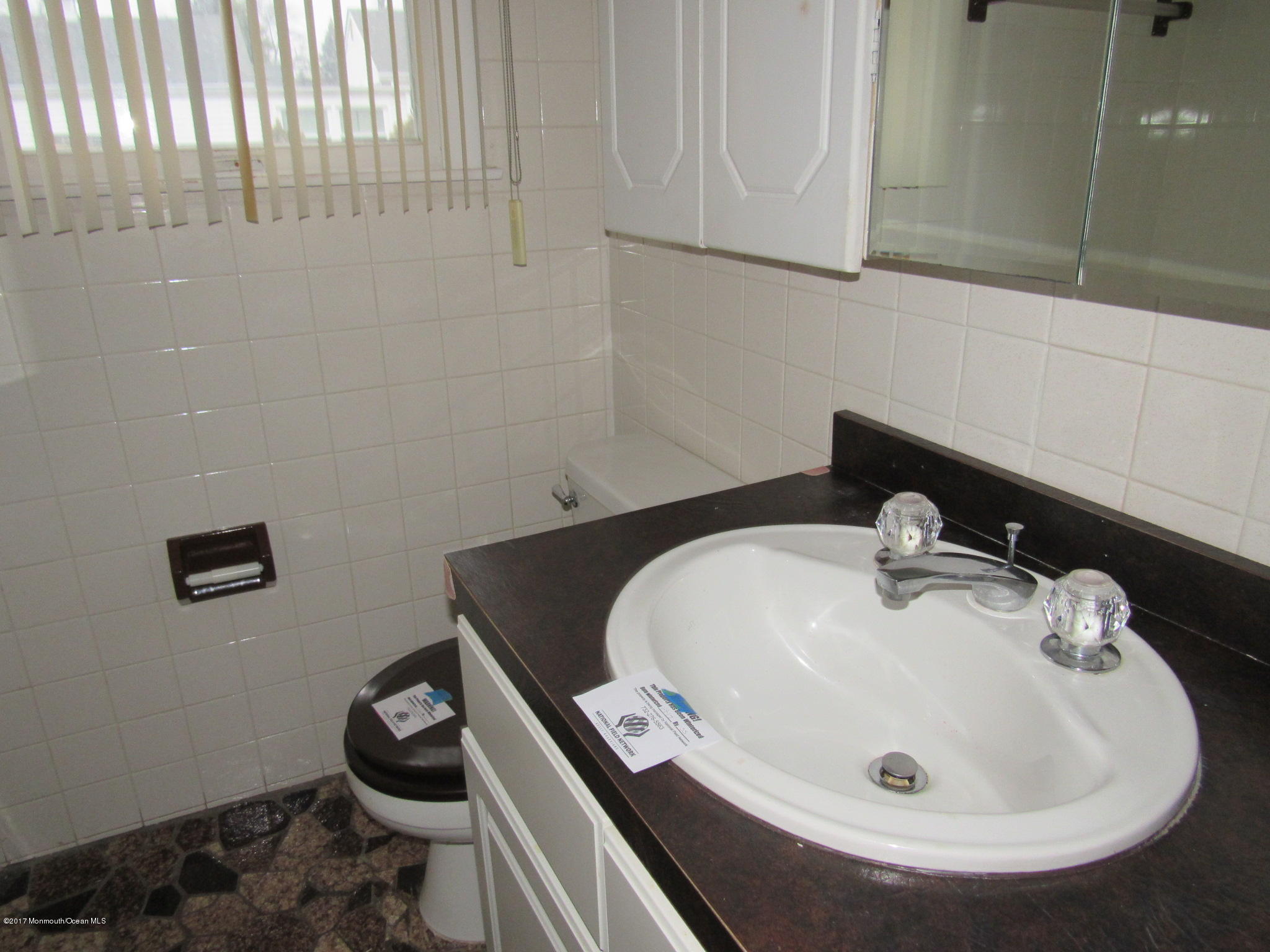 1136 Minnesink Road Manasquan, NJ 08736 - Photo 7 of 9 a bathroom with a sink and a toilet