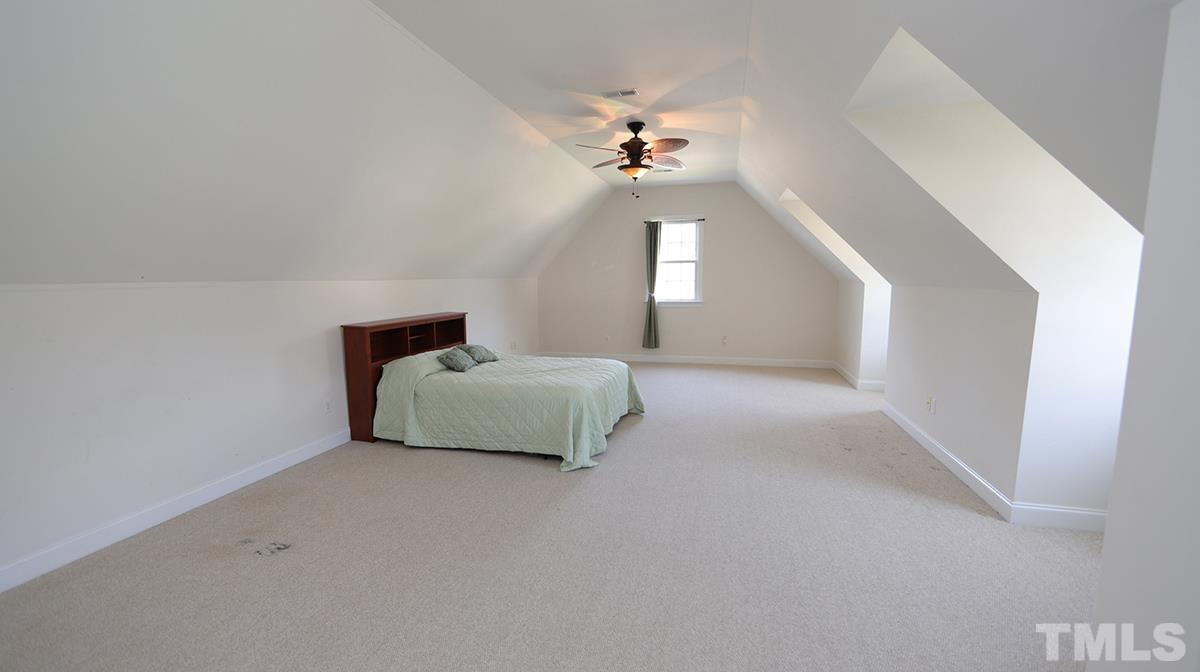 263 Waterville Street Raleigh, NC 27603 - Photo 11 of 18 a living room with furniture and a chandelier