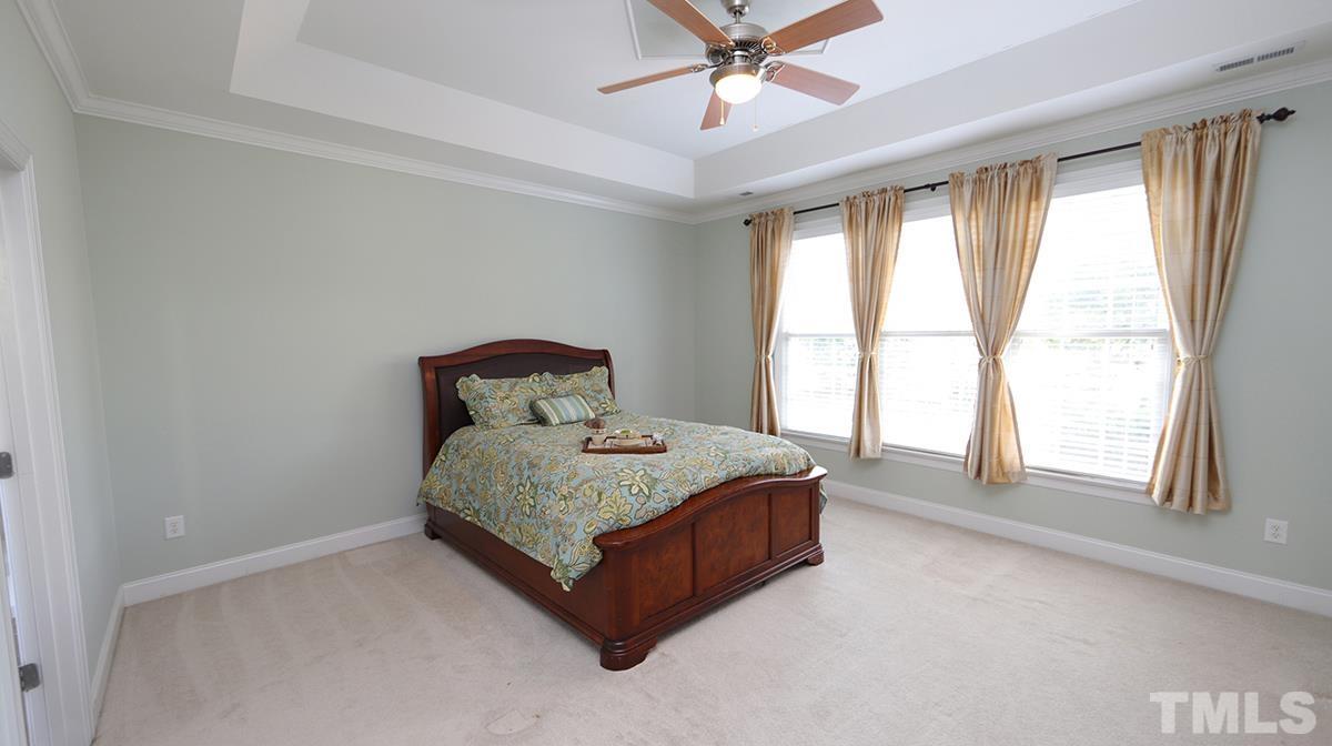 263 Waterville Street Raleigh, NC 27603 - Photo 12 of 18 a bedroom with a bed and window