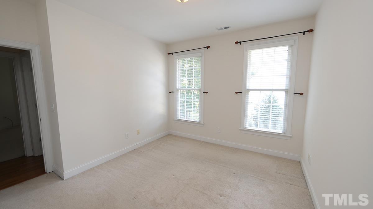 263 Waterville Street Raleigh, NC 27603 - Photo 8 of 18 an empty room with a window