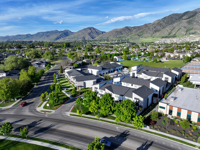 220 Spring Creek Parkway Providence, UT 84332 - Photo 16 of 17 Modern townhome community featuring contemporary architectural design and a vibrant green landscape