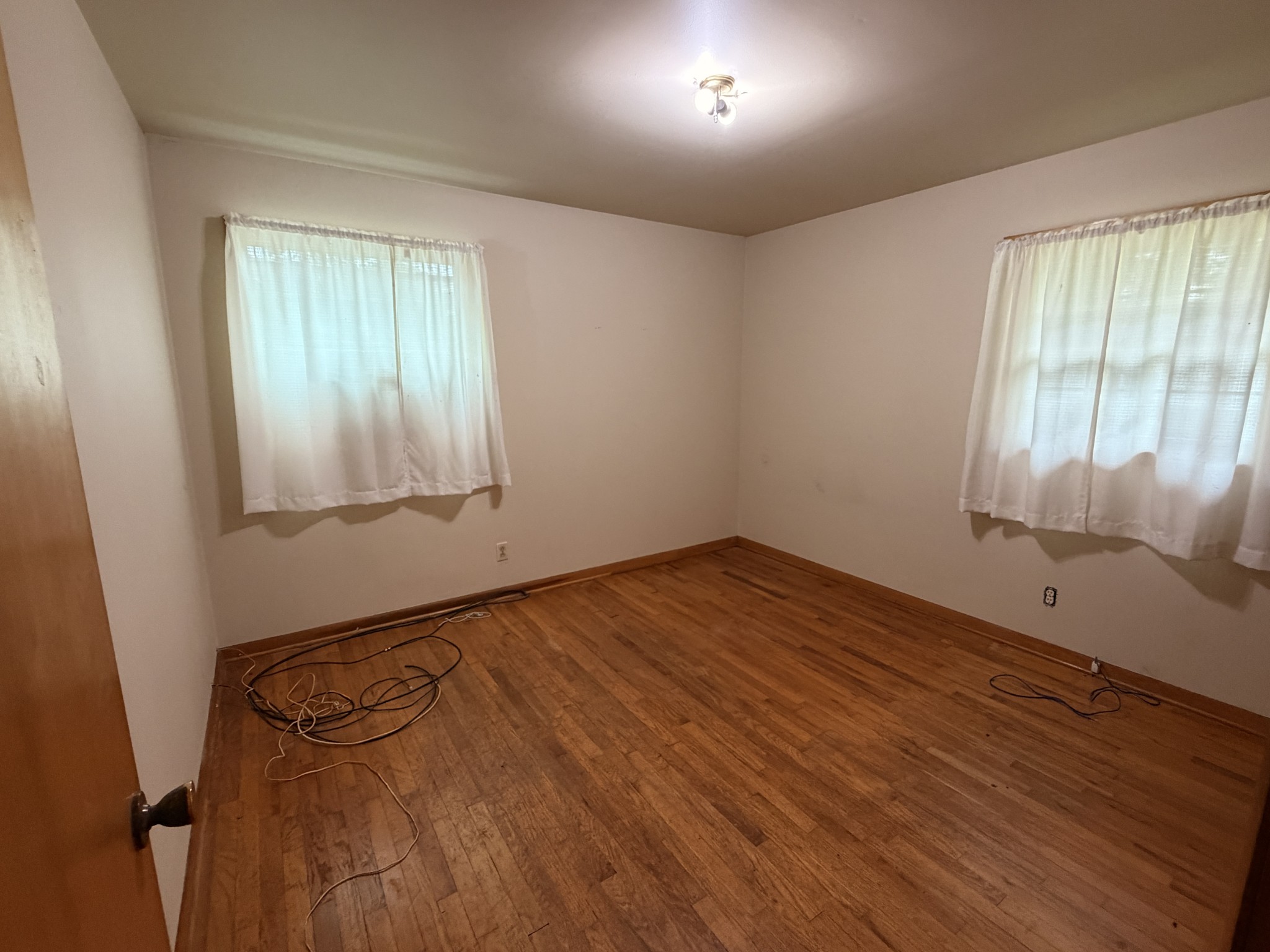 955 Rocky Road Pulaski, TN 38478 - Photo 8 of 10 wooden floor in an empty room with a window