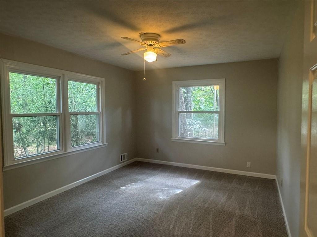 2550 Conyers Road McDonough, GA 30252 - Photo 18 of 29 a view of an empty room with a window