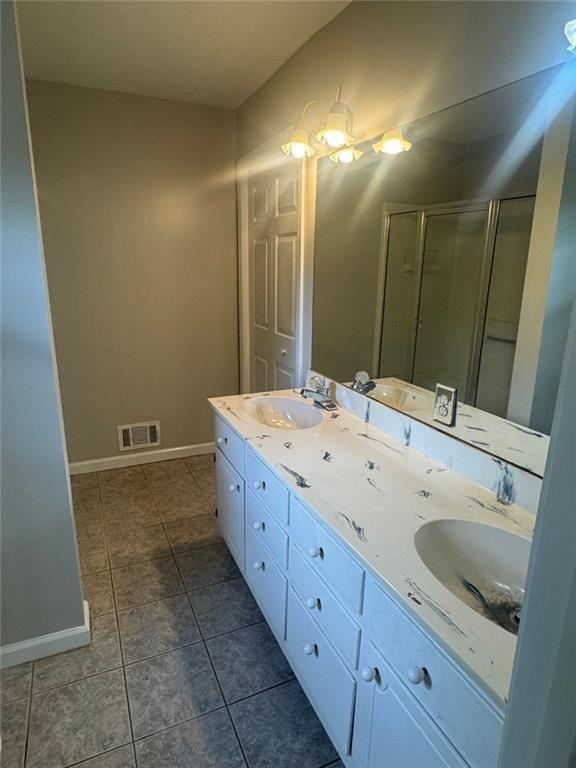 2550 Conyers Road McDonough, GA 30252 - Photo 21 of 29 a bathroom with a sink and a mirror