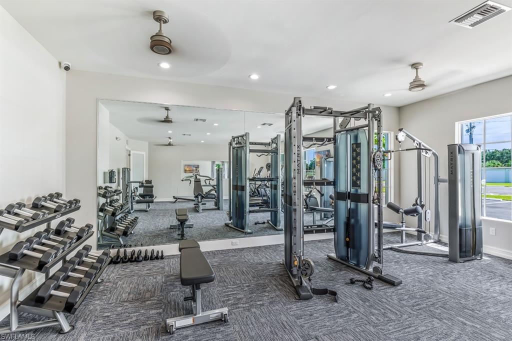 400 Grace Bay Lane Naples, FL 34114 - Photo 17 of 42 a view of a room with gym equipment